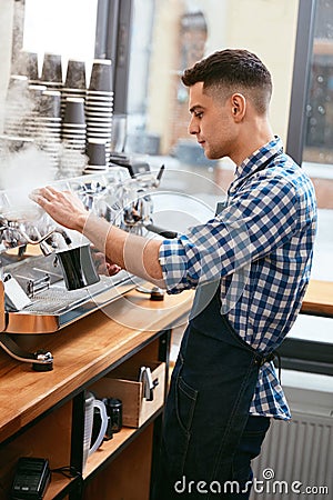 Making Coffee. Barista Using Coffee Machine In Cafe Stock Photo