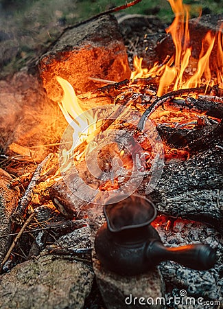 Making coffee process on campfire. Turkish cezva near open fire Stock Photo