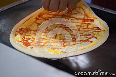 Making of crepes pancakes in open thailand street market Stock Photo