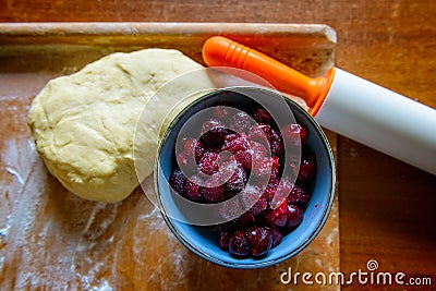 Making dumplings filled with sour cherryor cake Stock Photo