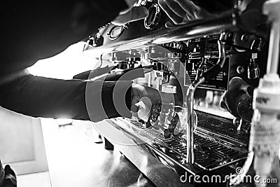 Making espresso coffee close up detail with modern machine Editorial Stock Photo