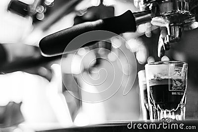 Making espresso coffee close up detail with modern machine Editorial Stock Photo