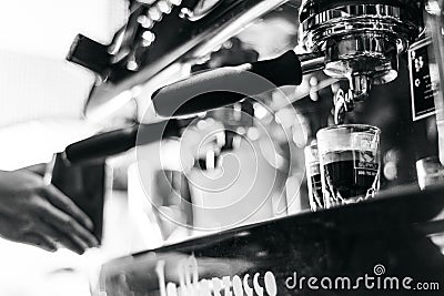 Making espresso coffee close up detail with modern machine Stock Photo