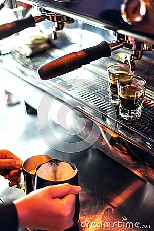 Making espresso coffee close up detail with modern machine Editorial Stock Photo