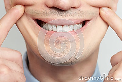 Making fake smile Stock Photo