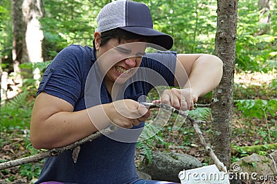 Making fire wood is hard Stock Photo