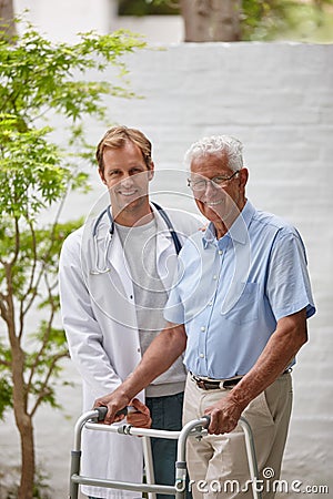 Making great progress with the help of his doctor. Portrait of a male doctor standing with his senior patient whos using Stock Photo