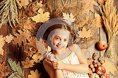 Making her hair shine. Little girl with wavy hairstyle on fall background. Hair salon for kids. Pretty girl with long Stock Photo