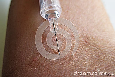 Making an injection on arm - macro photo Stock Photo
