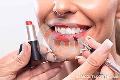 Making of kissable lips with permanent makeup Stock Photo