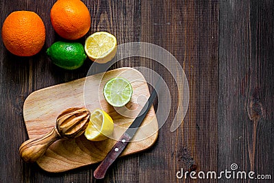 Making lemonade. Cookware and fruits on wooden table background top view copyspace Stock Photo