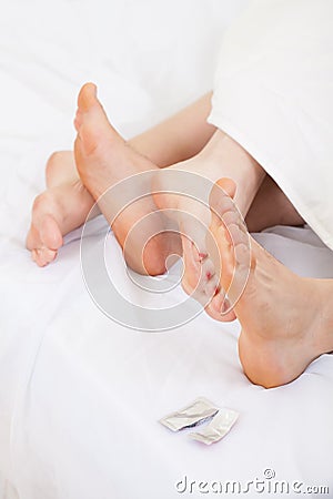 Making love with contraception Stock Photo