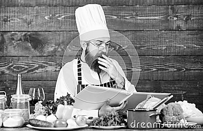 Making nutritional choice. Vegetarian salad with vegetables. Healthy food cooking. Mature hipster with beard. Dieting Stock Photo