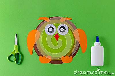 Making a owl with color paper, glue and scissors Stock Photo