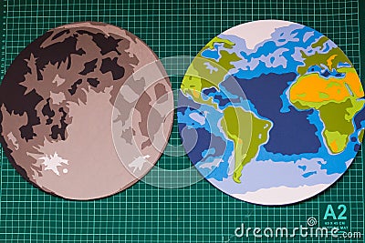 Making paper mockup of the moon and earth Stock Photo