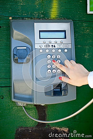 Making phone calls in the call-box Stock Photo