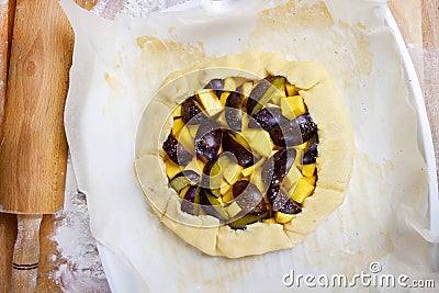 Making plum and pumpkin galette Stock Photo