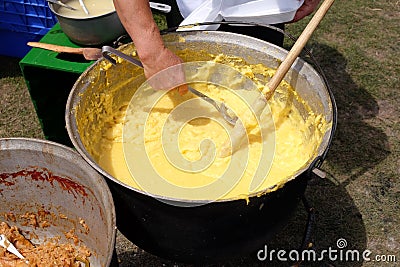 Making polenta in caldron traditional recipe Stock Photo