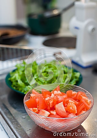Making salad in kitchen Stock Photo