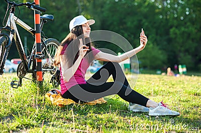 Making a selfie young women with bike Stock Photo