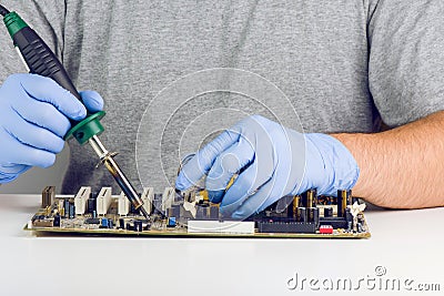 Making A Soldering On Motherboard Microchip Stock Photo