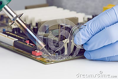 Making A Soldering On Motherboard Microchip Stock Photo