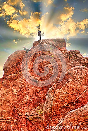 A motivational image of climbers making it to the top of a beautiful rock! Stock Photo