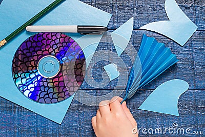 Making toy fish from the CD. Handmade children's project. Step 6 Stock Photo