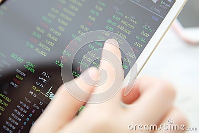 Making trading online on the tablet with business woman hand Stock Photo