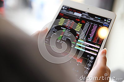 Making trading online on the tablet with business woman hand Stock Photo