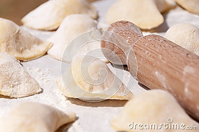 Making traditional food pierogy with dough roller Stock Photo