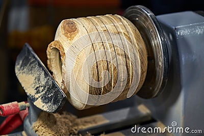 Making a wooden vase on a lathe. Stock Photo