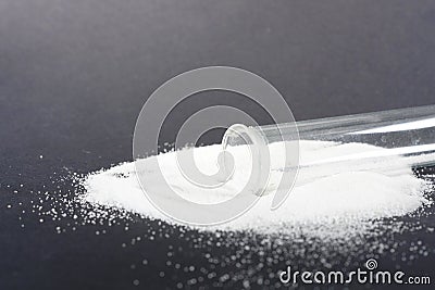 Makrogol powder photographed against a black background in the studio Stock Photo