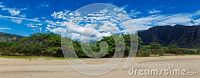Makua beach panoramic view with beatiful mountains and cloudy sky in the background, Oahu island Stock Photo