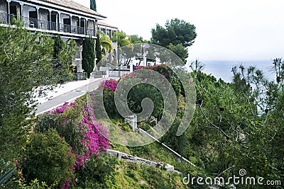 Malaga, Spain, February 2019. Beautiful villa against the backdrop of the Mediterranean is immersed in spring flowers. Editorial Stock Photo