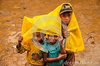 Malagasy kids in the rain Editorial Stock Photo