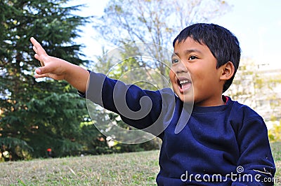A Malay child with a hand raised up Stock Photo