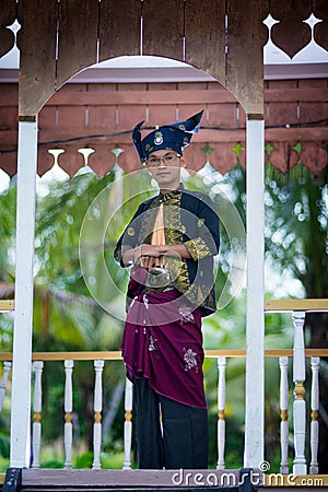 Malay men`s traditional clothing used by royal warriors / Malay warriors Editorial Stock Photo