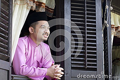 Malay muslim man smile Stock Photo