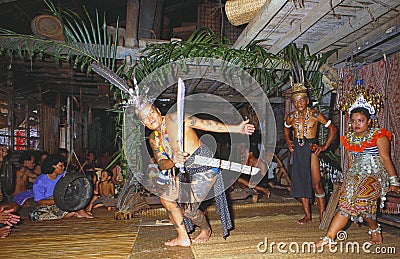 Malaysia/Borneo: Iban Headhunter ceremony in a typical long house in the rain forest of Sarawak Editorial Stock Photo