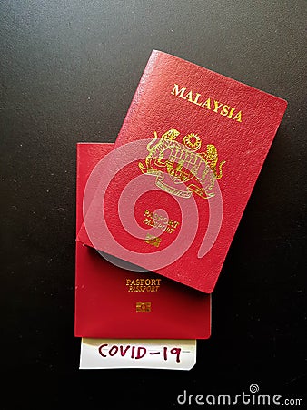 Malaysia Passport with Covid-19 Note Editorial Stock Photo