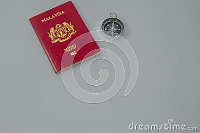 Malaysian red passport with compass Stock Photo