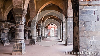 The arches in the arcaded corridors and interiors of the ancient Adina Masjid mosque in Stock Photo