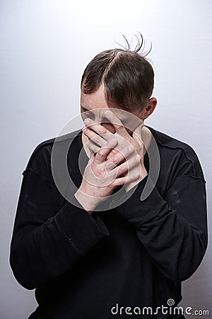 Male alcoholic and drug addict of a sickly appearance on a white background Stock Photo