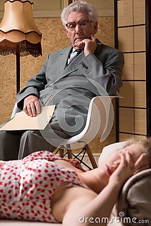 Male analyst and despair woman Stock Photo