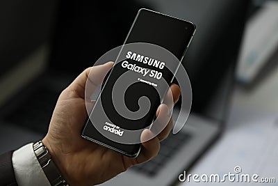Male arm holding samsung galaxy s 10 Editorial Stock Photo