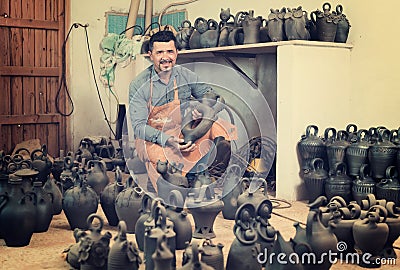 Male artisan with ceramic vases Stock Photo