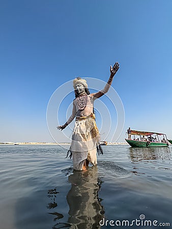 Male artist act as lord krishna with painted face during masaan holi in varanasi Editorial Stock Photo