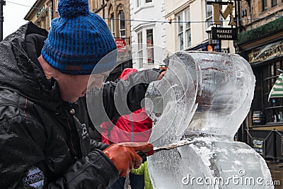 Male artist sculpting and ice scultpure Editorial Stock Photo