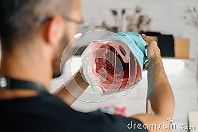 Male artist sculptor artisan creates a vase with his own hands in an art workshop Stock Photo